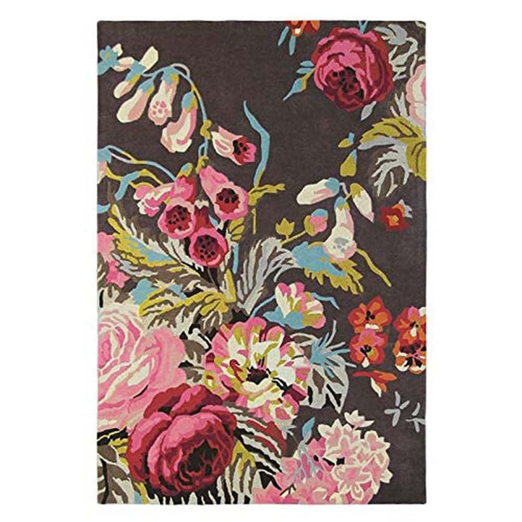 Floral patterned rug with pink, red, and yellow flowers on a dark background
