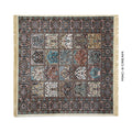 A rectangular patterned rug with cream fringe on all sides, shown flat against a white background. The rug features a complex traditional design with multiple panels in cream, blue, brown, and black.