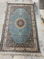 Traditional floral medallions and deep green tones