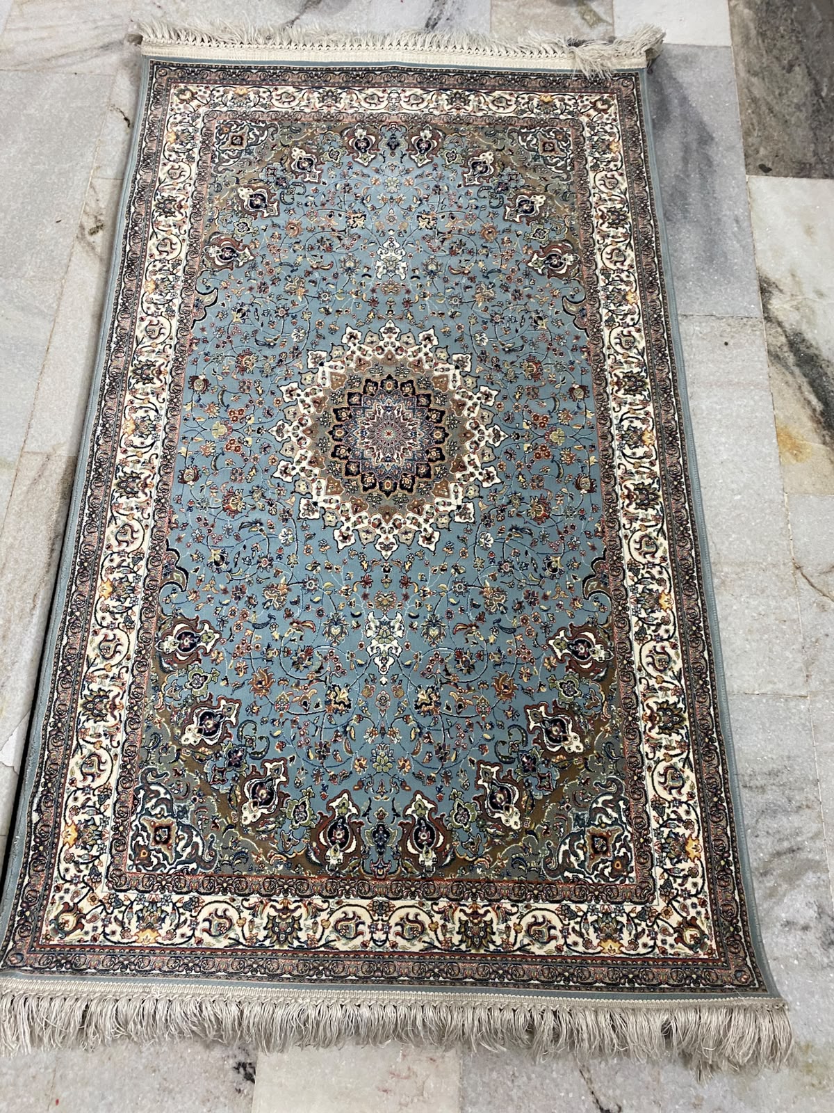 Traditional floral medallions and deep green tones